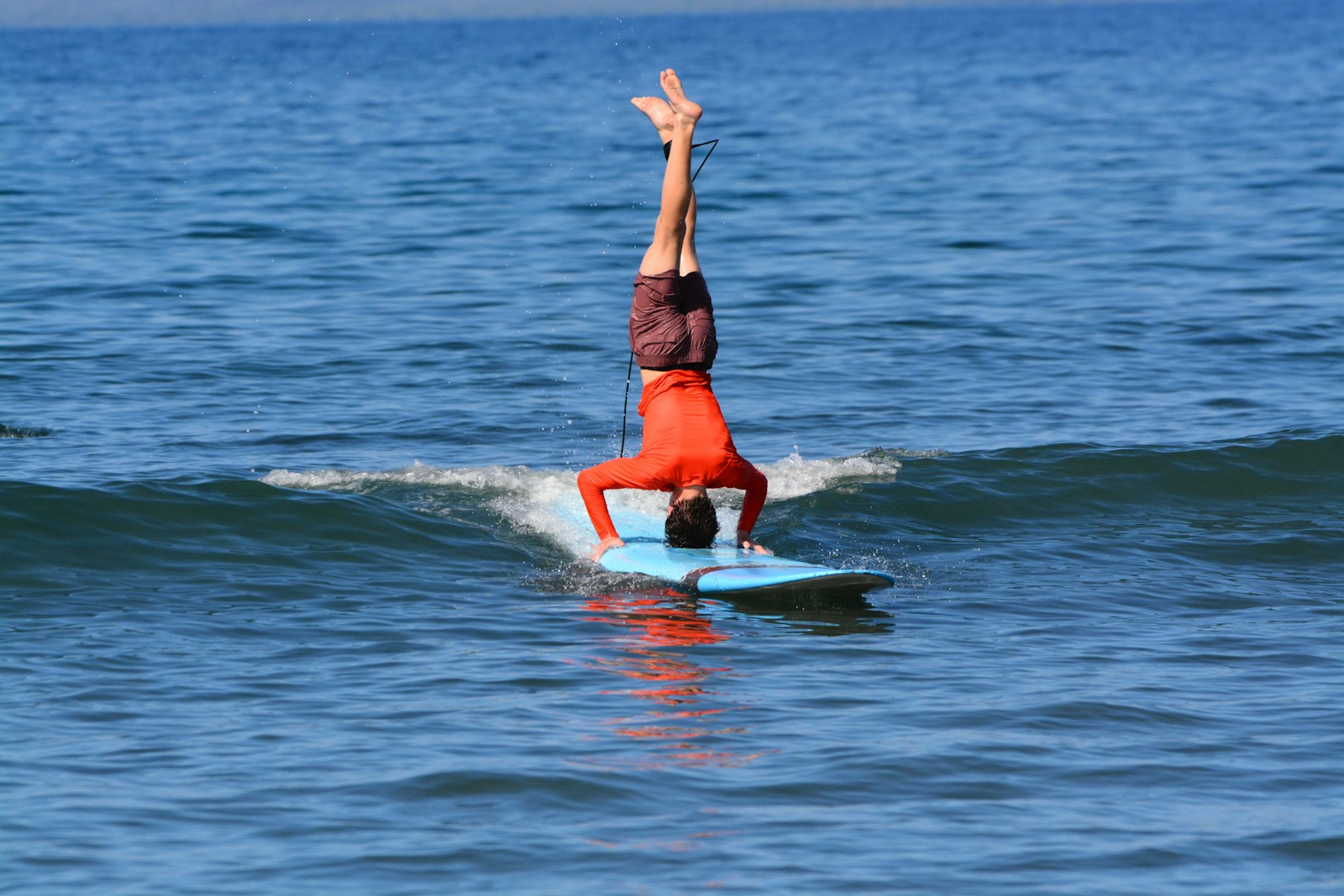 a person riding a surf board on a body of water
